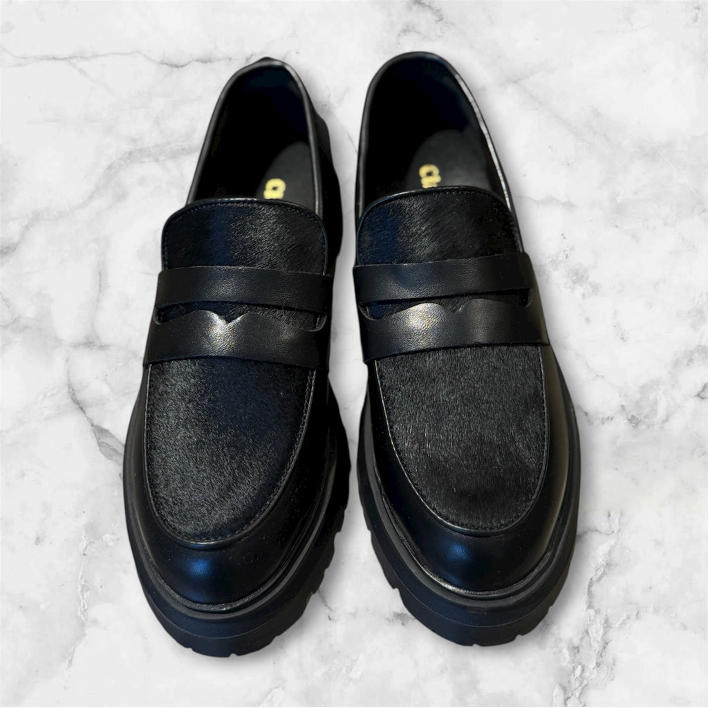 MOCASSINO DONNA PELLE NERA EFFETTO PELO SUOLA CARRARMATO